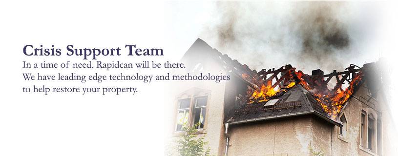 A house with a pitched roof is engulfed in flames and smoke, accompanied by text about a crisis support team offering water damage restoration services.