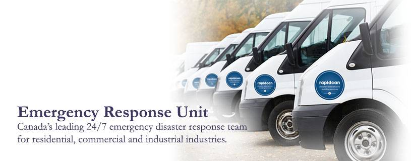 A row of white vans labeled "emergency response unit," including water damage restoration and plumber services, parked diagonally, advertising Canada's leading 24/7 emergency disaster response team for various industries.